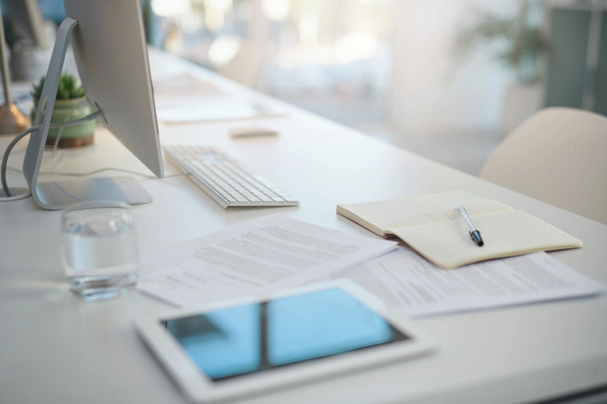 Business documents and laptop on an office desk