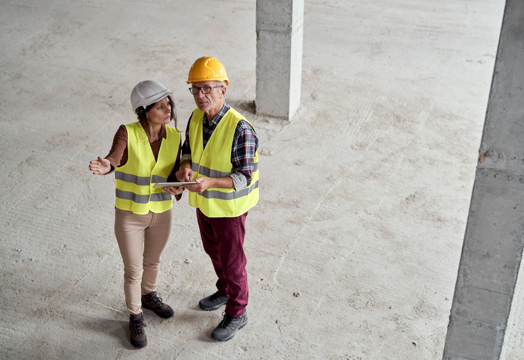 Engineers discussing plans at a construction site