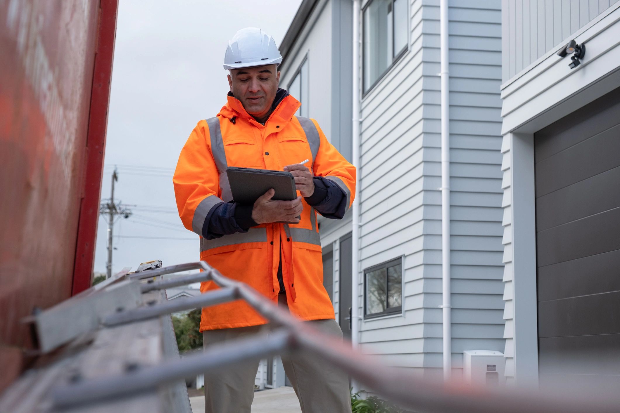 Site manager reviewing reports on a tablet