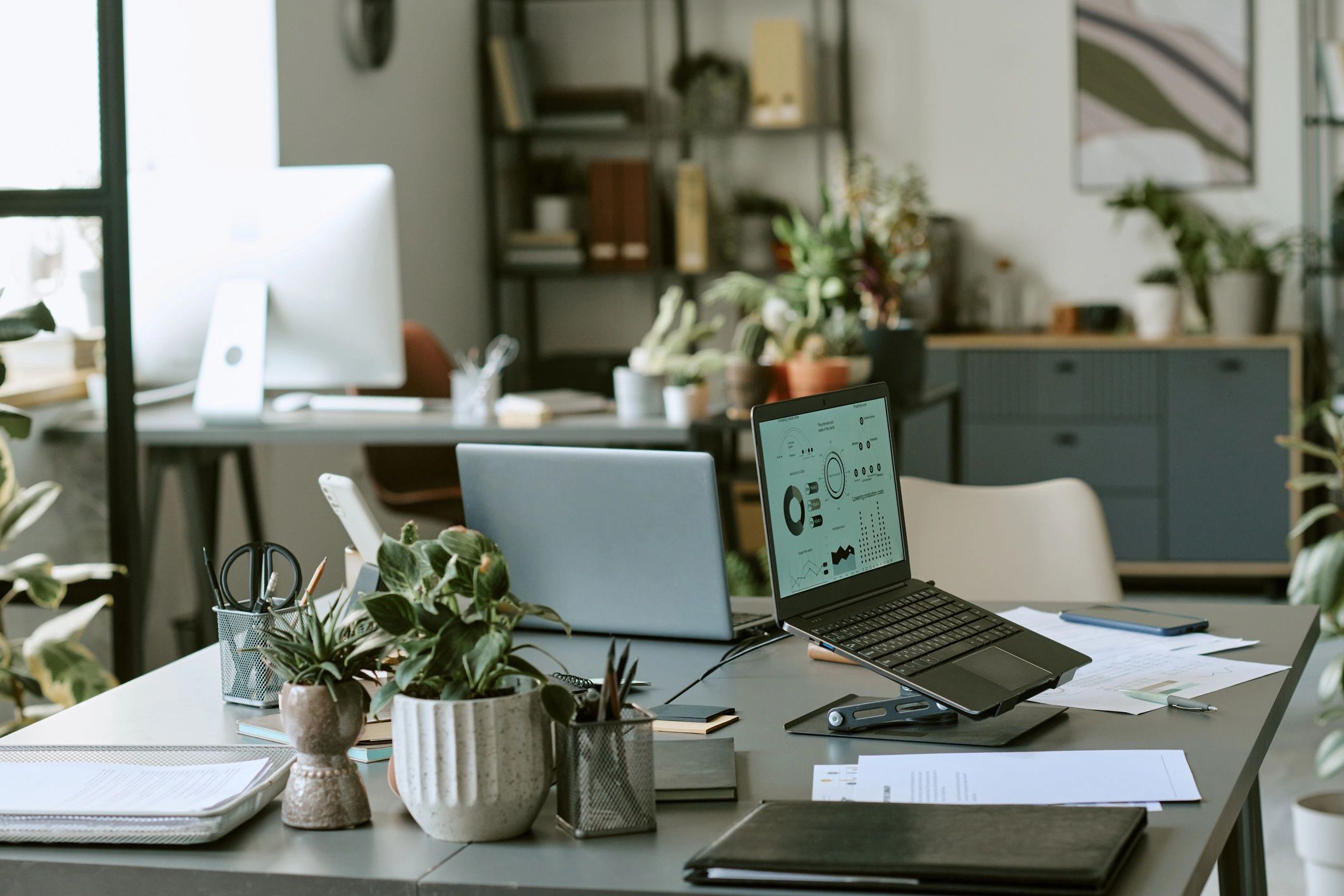 Modern office workspace with financial data screens